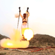 Image for article titled Saudi men fly through the air firing their rifles in stunning photos